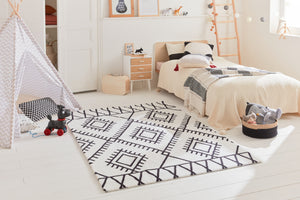 Créer une atmosphère chaleureuse avec des tapis de chambre  - Bruge Interiors