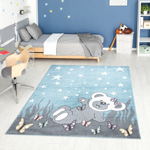 Tapis enfant bleu avec un motif d'ourson sous les étoiles Ruby