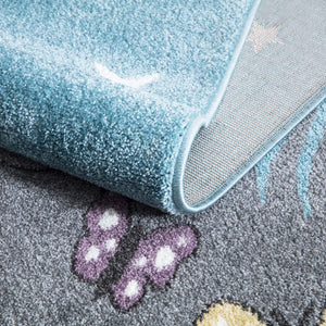 Tapis enfant bleu avec un motif d'ourson sous les étoiles Ruby