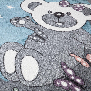 Tapis enfant bleu avec un motif d'ourson sous les étoiles Ruby