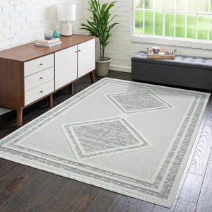 Tapis gris effet laine bouclée à motif losange et franges - LANA Lana