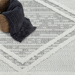 Tapis gris effet laine bouclée à motif losange et franges - LANA Lana