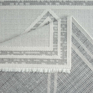 Tapis gris effet laine bouclée à motif losange et franges - LANA Lana