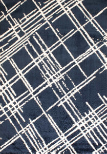 Tapis abstrait bleu motif géométrique Bruge interiors