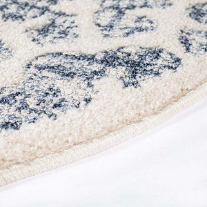 Tapis scandinave bleu et crème avec des franges tressées Nora