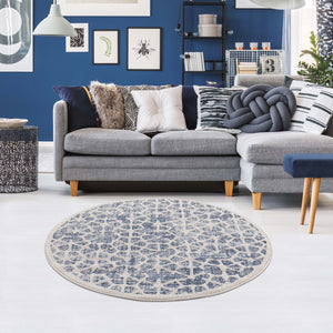 Tapis scandinave bleu et crème avec des franges tressées Nora