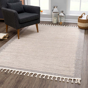 Tapis marron à franges tréssées style scandinave bleu avec motif lignes blanches Nora