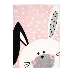 Tapis enfant rose avec un motif de tête de lapin _ HUGGY Huggy