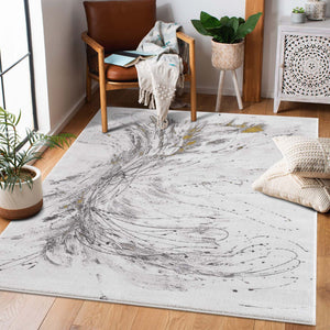 Tapis motif abstrait artistique gris avec une pointe de doré - PRIA Pria