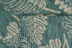 Tapis moderne motif palmier turquoise Bruge interiors